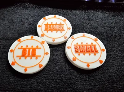 White and orange 3D-printed dealer, small blind and big blind poker tokens