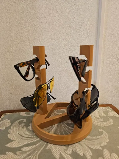 Orange multi-tower 3D-printed stand holding several pairs of sunglasses