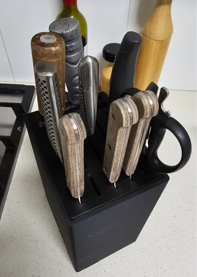 Updated black 3D-printed knife holder with additional knife and scissor storage